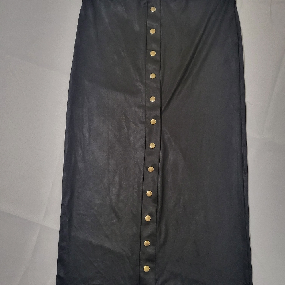 Black midi skirt with gold snap buttons. Size medium